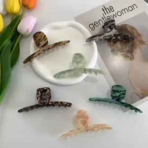 French style long acetate hair claws set in various marble and amber texture patterns