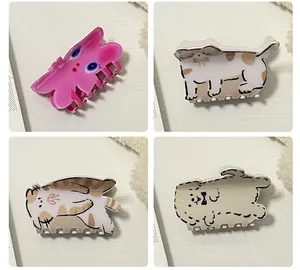 Détail de quatre pinces à cheveux animaux mignons avec motifs lapin, chat et chiot