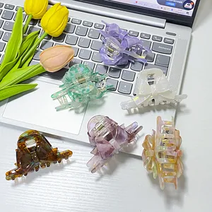 Set mit sechs eleganten Haarklammern in Schleifenform mit Marmor- und Blumenmuster