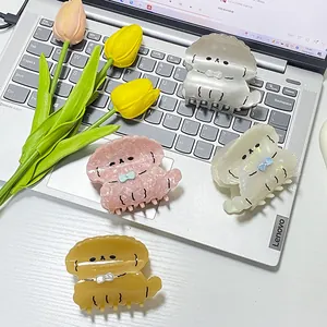 Pinzas de pelo de acetato con forma de cachorro en colores blanco rosa y ámbar