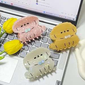 Set de pinzas para el cabello de acetato con forma de cachorro en rosa, amarillo y blanco