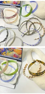Detail of vintage checkerboard and acetate headbands with smooth anti-slip teeth design