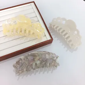 Detailed set of 14cm acetate crown hair claws in marble yellow, cream white, and lavender