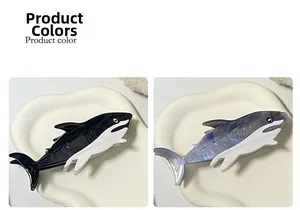 Detail view of acetate shark hair claws in black, white, and marbled blue purple colors
