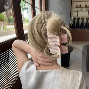 Pink and white striped acetate hair claw clip with gold M letter for thick hair styling
