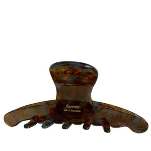 Classic tortoiseshell acetate hair claw clip with blue spots and gold lettering