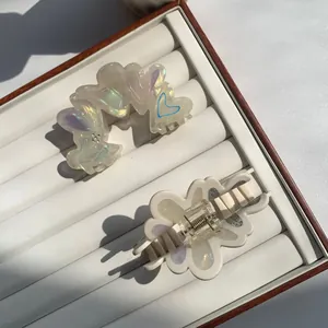 Chic heart-shaped acetate hair claw clips with iridescent finish and metal spring