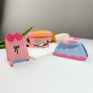 Cute bird in cup and sweater shaped acrylic hair claws on a stylish display