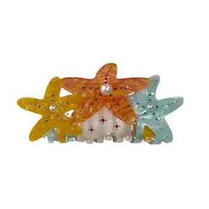 Starfish hair claw clip featuring colorful acetate sea stars with pearls and rhinestones