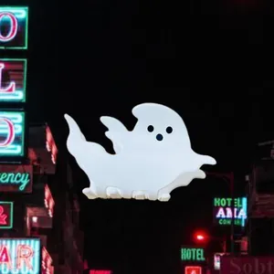 Detailed view of a white ghost-shaped acrylic hair claw clip for Halloween theme