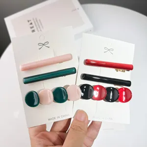 Elegant acetate resin hair clip set with pastel and bold colors on a white display card