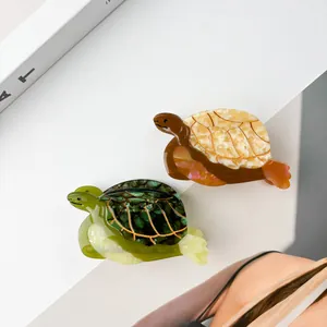 Pinces à cheveux tortue en acétate avec motifs marbrés verts et écaille