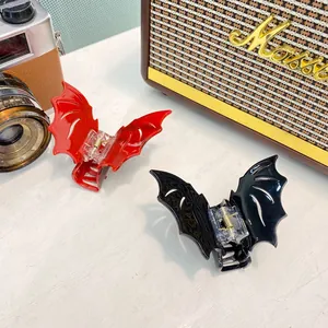 Gothic bat wing hair claw clips in red and black acrylic for Halloween accessories