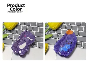 Detail view of purple marble acetate shark clips with dinosaur and cat fish cartoon charms
