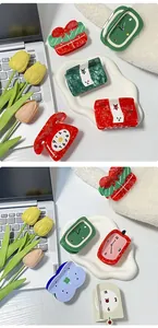 Detailed view of colorful acetate hair claws in creative clock and wallet shapes