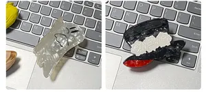 Detailed shot of ghost and top hat acetate hair claws with marble texture and cute designs