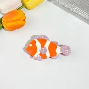 Vibrant clownfish hair claw clip with orange and white stripes for ocean style hair styling