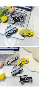 Detail of car-shaped acetate hair claws including police car and taxi designs