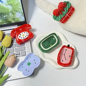 Fashionable acetate hair claws featuring creative vintage phone and clock shaped designs