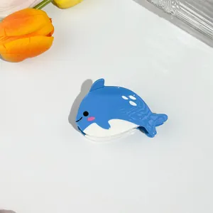 Blue and white whale hair claw clip made of glossy acetate in ocean animal design
