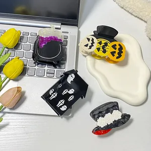Halloween claw clip set featuring pumpkin ghost and witch cauldron designs in acetate