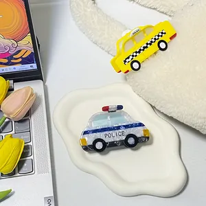 Creative car-shaped acetate hair claws featuring yellow taxi and blue police car designs