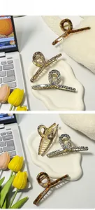 Three acetate hair claws in tortoiseshell and leopard patterns with strong metal springs