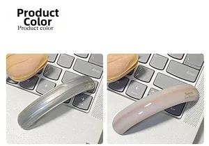 Detailed view of grey and pink curved resin hair barrettes with gloss finish