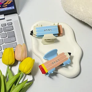 Set di due mollette per capelli a forma di matita con strass in blu e corallo