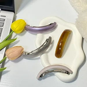 Set of 4 minimalist curved hair clips in purple, grey, amber, and light pink colors