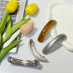Set of four elegant curved spring hair clips in amber and pastel colors for women