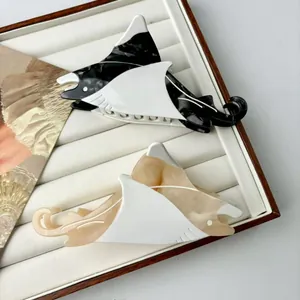 Chic acetate ray-shaped hair claw clips with marble texture for elegant hairstyles
