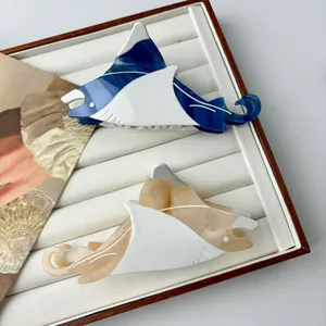 Marine manta ray acetate hair claws in navy blue and cream white color combination
