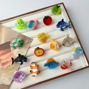 Mini acetate animal hair clips featuring octopus, dolphin and shark shapes in vibrant colors