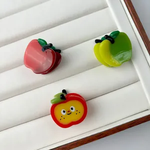 Mini apple shaped acetate hair claw clips in red and yellow green glossy finish