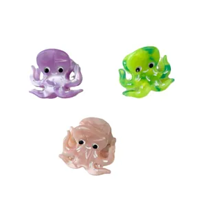 Mini acetate octopus hair claws set in purple, green, and pink with a glossy finish