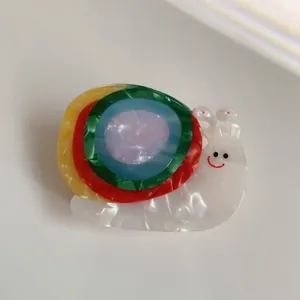 Colorful acetate snail hair claw clip with vibrant concentric circles for women