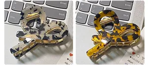 Detailed view of acetic acid shark hair clips in marble white and tortoiseshell patterns