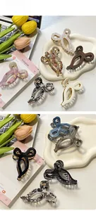 Détails des pinces à cheveux noeud en acétate avec motifs marbrés et à carreaux variés