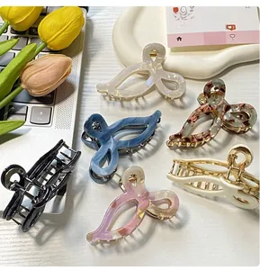 Collection de pinces à cheveux en acétate avec nœuds et motifs marbrés variés