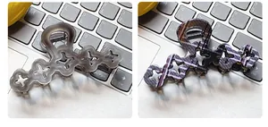 Detail of elegant floral hair claws in smoky grey and purple plaid patterns