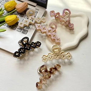 Elegant hollow floral hair claw clips set in various soft pearlescent colors