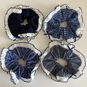 Navy blue scrunchie set featuring plaid, stripe patterns with elegant white ruffled edges