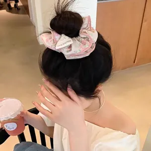 Pink floral chiffon scrunchie for hair buns with delicate edge and Korean style design