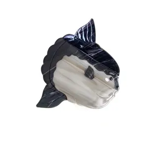 Elegant sunfish shaped acetate hair claw clip with black and white marble pattern