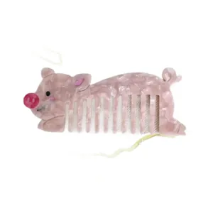 Pink acetate wide-tooth hair comb featuring a cute pig shape with marble texture