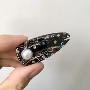 Chic multi-color rhinestone and pearl acrylic hair clip with vintage black and white patterns