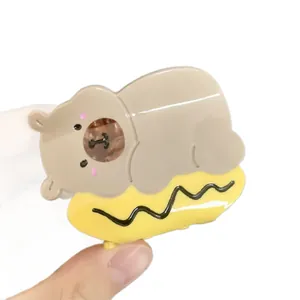 Cute brown bear acetate hair claw clip with yellow wave base for elegant hair styling