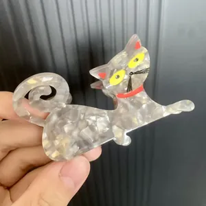 French acetate dog-shaped hair clip with grey marble texture and rhinestone details