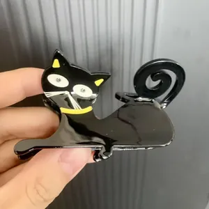 French acetate black cat hair clip with sparkling rhinestone eyes and yellow accents